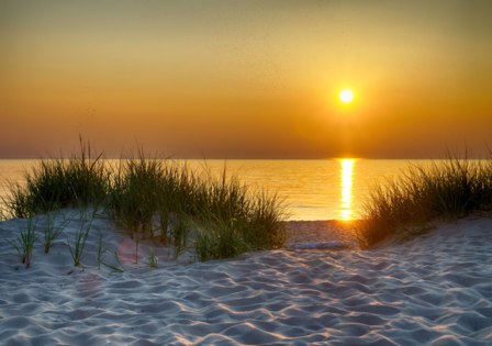 Zonsondergang strand fotobehang